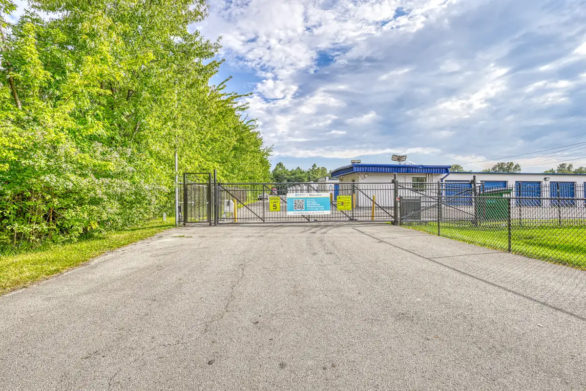 Gated entry drive and perimeter fencing leading to the MyPlace Self Storage facility in Indianapolis.
