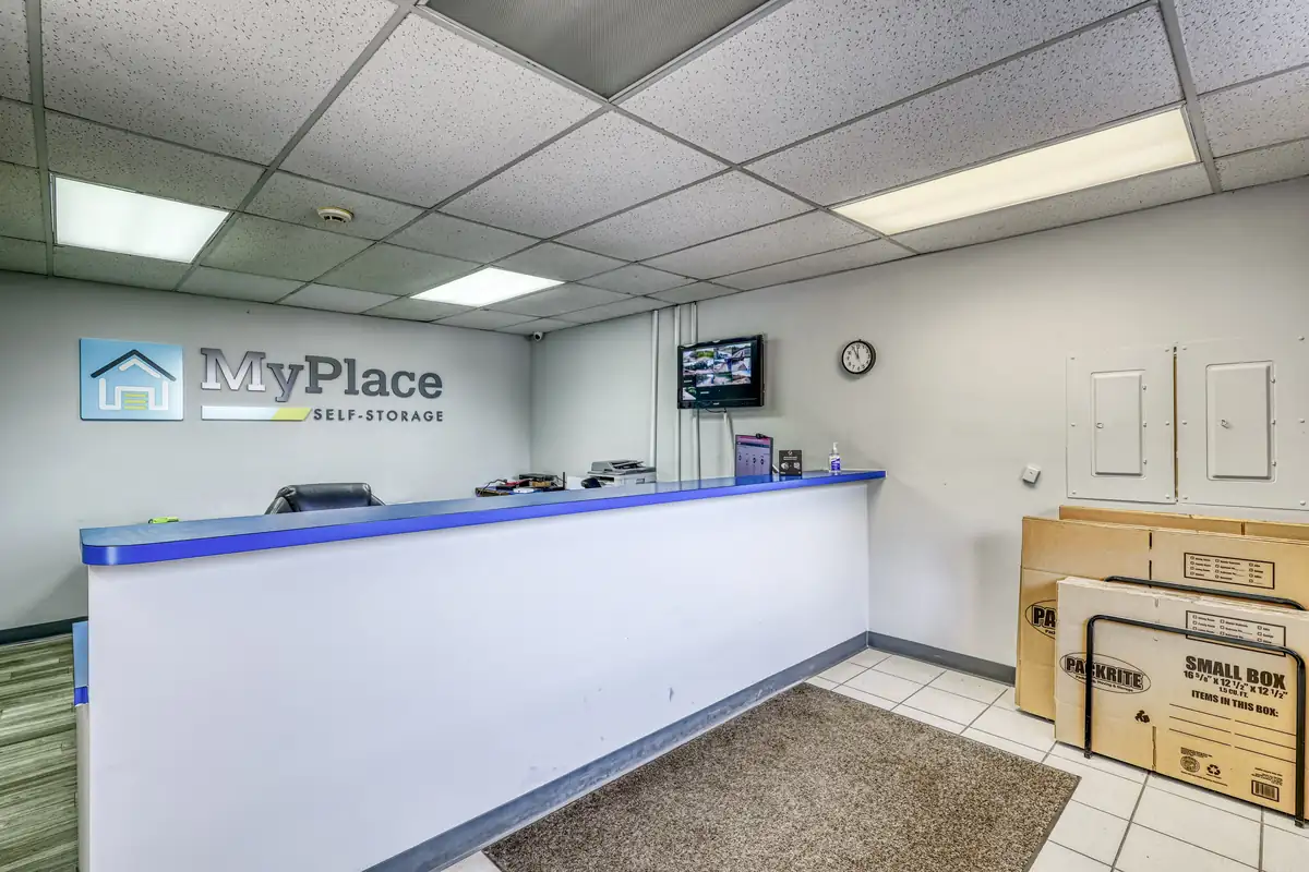 Inside the leasing office at MyPlace Self Storage on 10th St, showing the front service counter and wall logo.