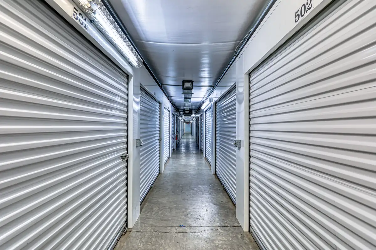 Clean, brightly lit interior hallway featuring secure climate-controlled storage units at MyPlace Asheville.