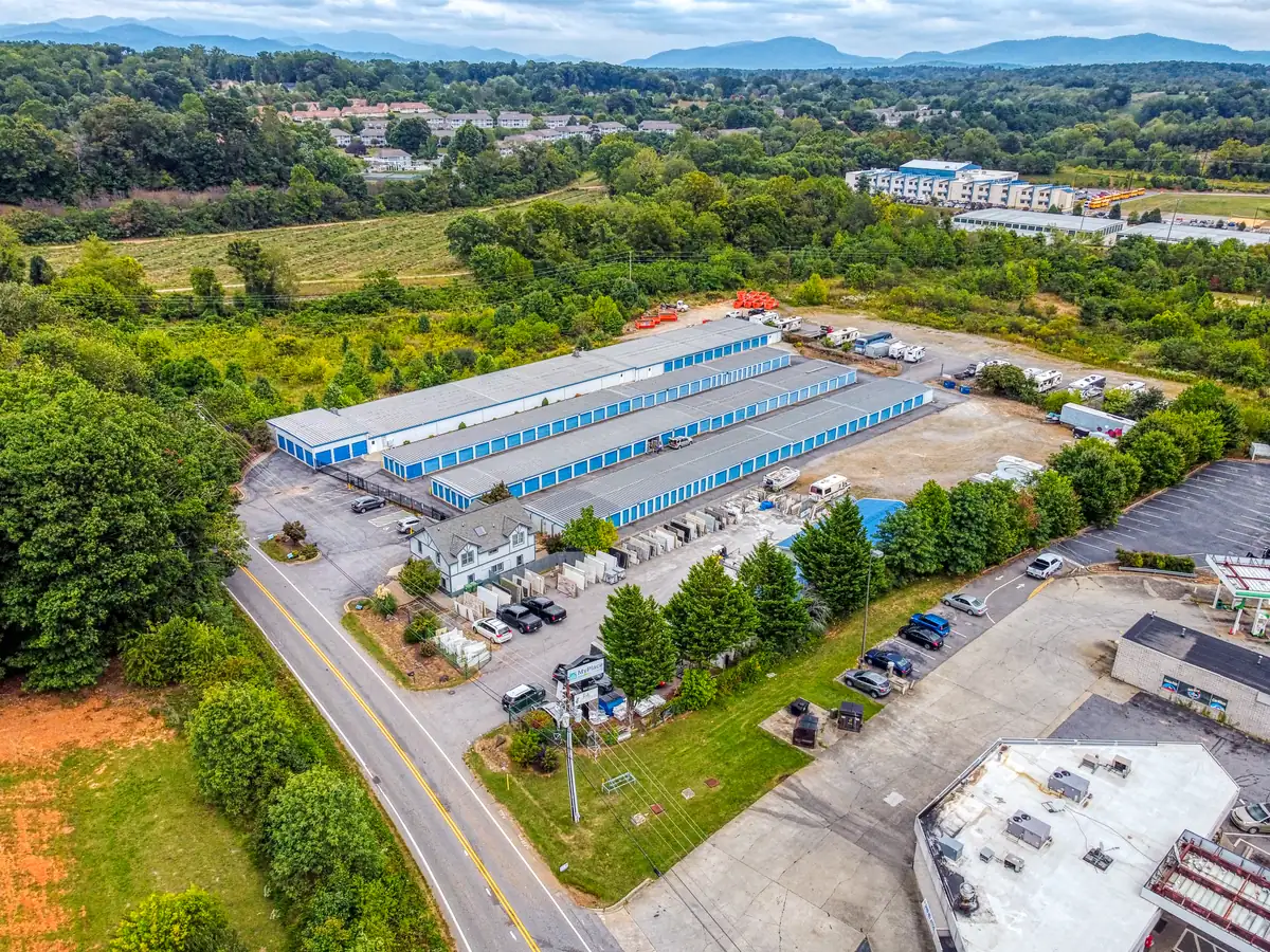 Aerial view of MyPlace Self Storage facility in Asheville, NC, showcasing multiple storage buildings and wide driveways.