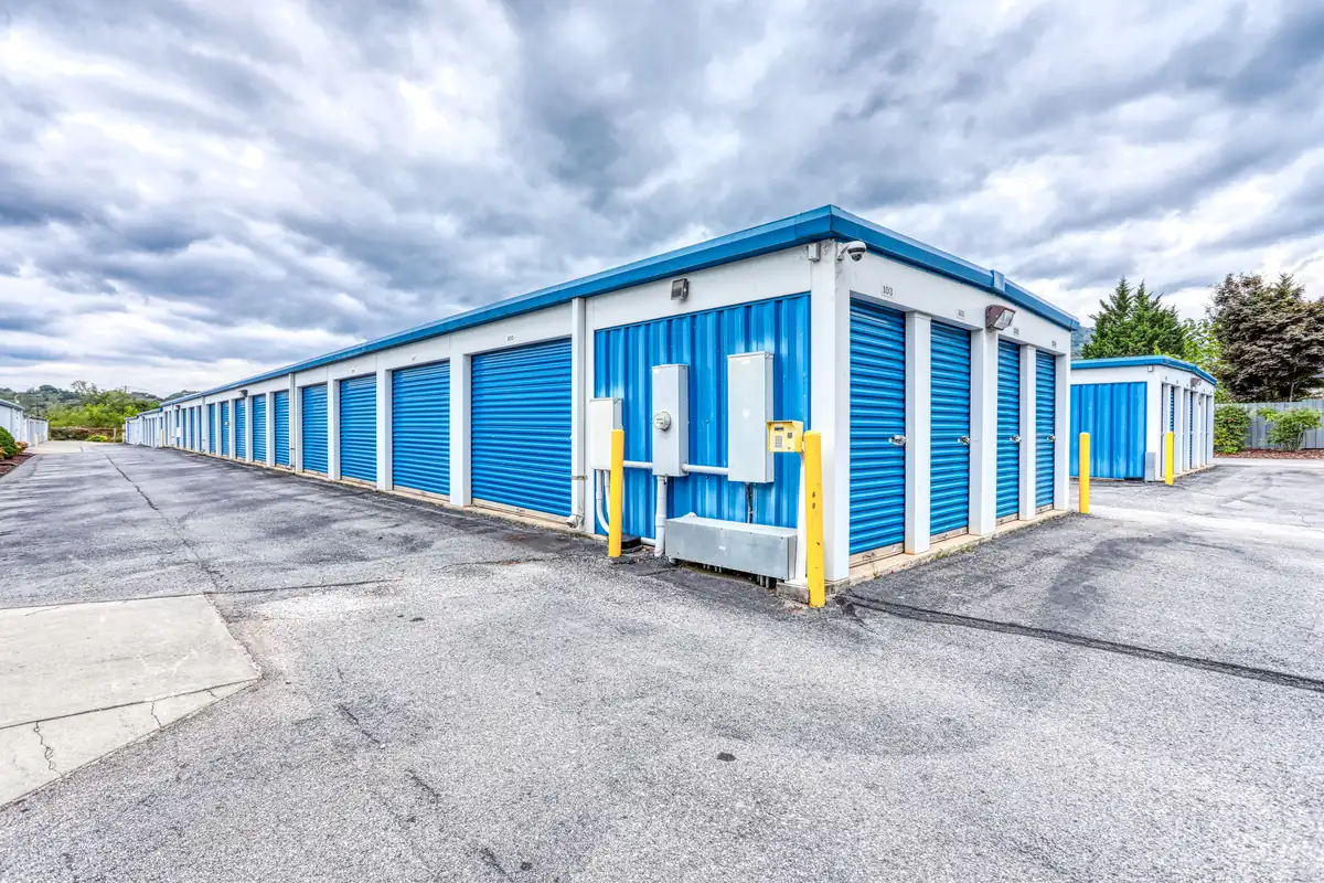 Wide exterior drive aisles between drive-up self-storage buildings, allowing easy access for large moving trucks.