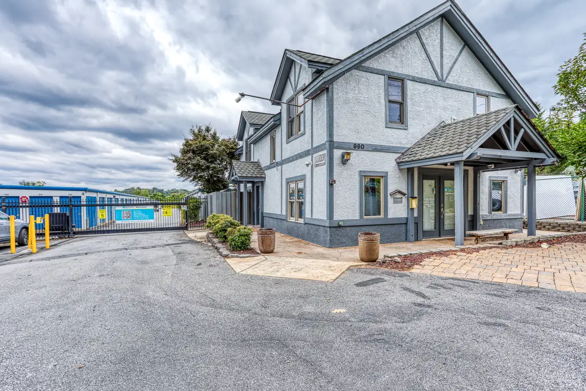 Exterior view of the main leasing office and customer parking area at MyPlace Self Storage Asheville.