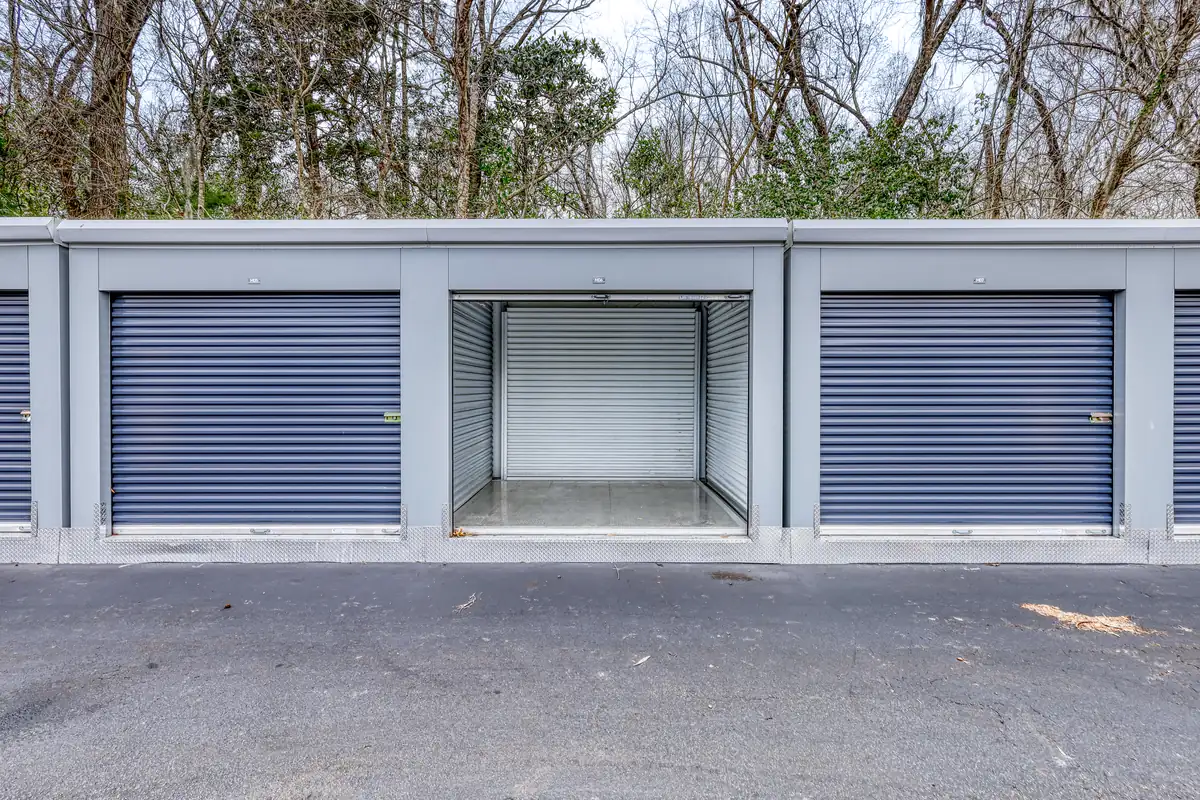 Open empty storage unit with roll-up door at MyPlace Self-Storage on Ashley River Road.