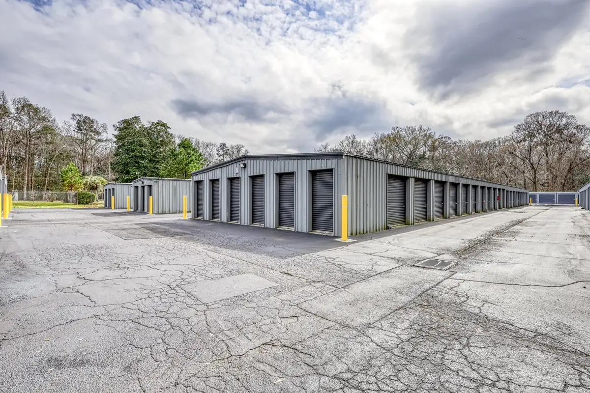 Corner view of drive-up storage buildings and paved drive at MyPlace Self-Storage on Ashley River Road in Charleston, SC.