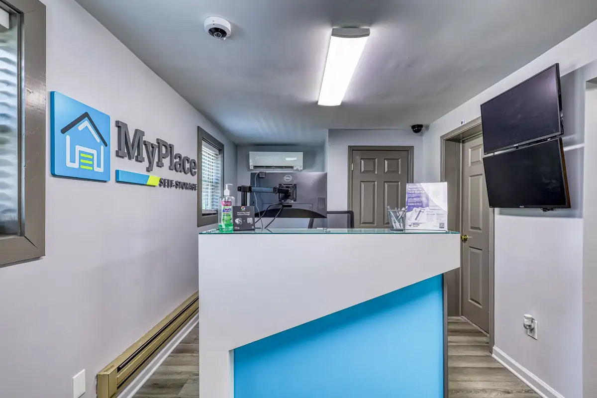 Inside the leasing office at the Cicero location, featuring a customer service desk and MyPlace wall signage.