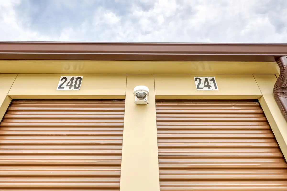 Close-up of brown drive-up storage unit doors numbered 240 and 241 at MyPlace Self Storage in Cicero.