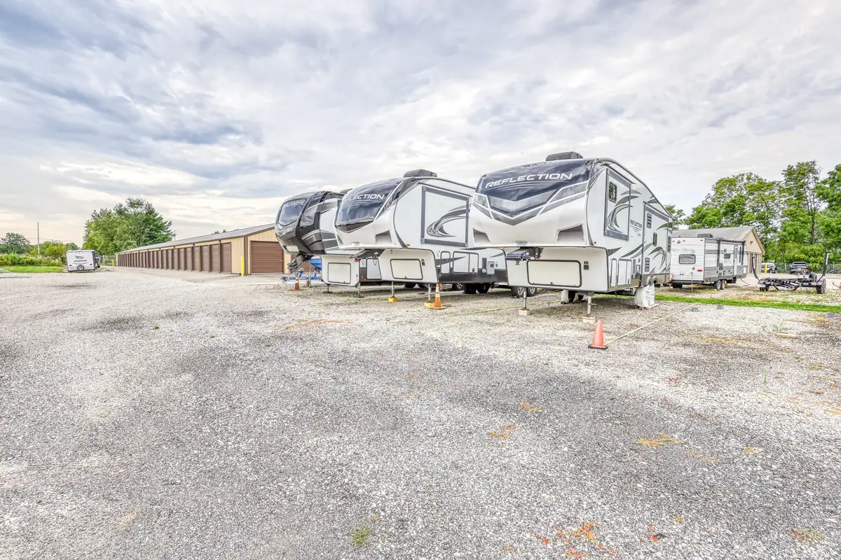 Uncovered outdoor parking area at the Cicero facility with several large RVs parked.