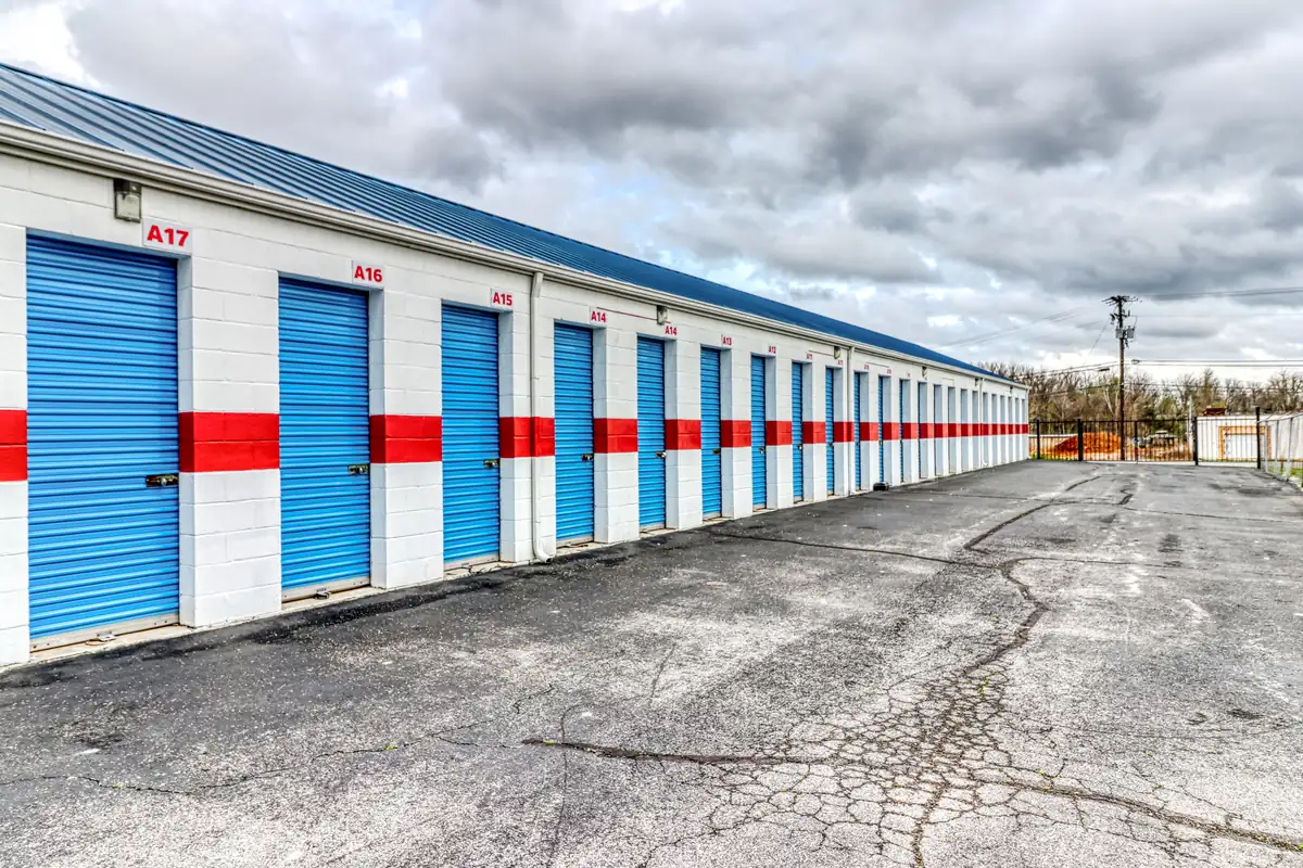 Wide drive aisle between rows of drive-up storage units at MyPlace Self-Storage Collier Road.