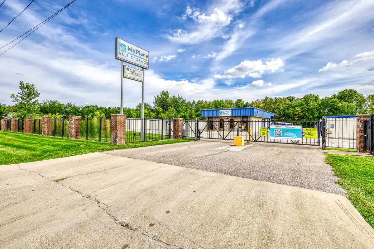 Gated entrance, driveway, and main sign for MyPlace Self Storage in Danville, IL.