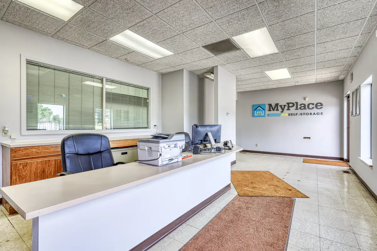 Inside the leasing office at MyPlace Self Storage in Danville, showing the front desk and wall logo.