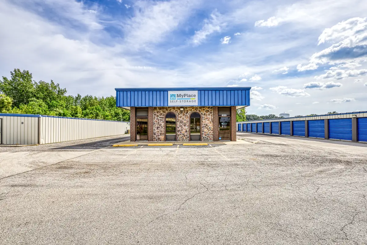 Front exterior of the MyPlace Self Storage office in Danville, IL featuring a stone facade and blue roof.