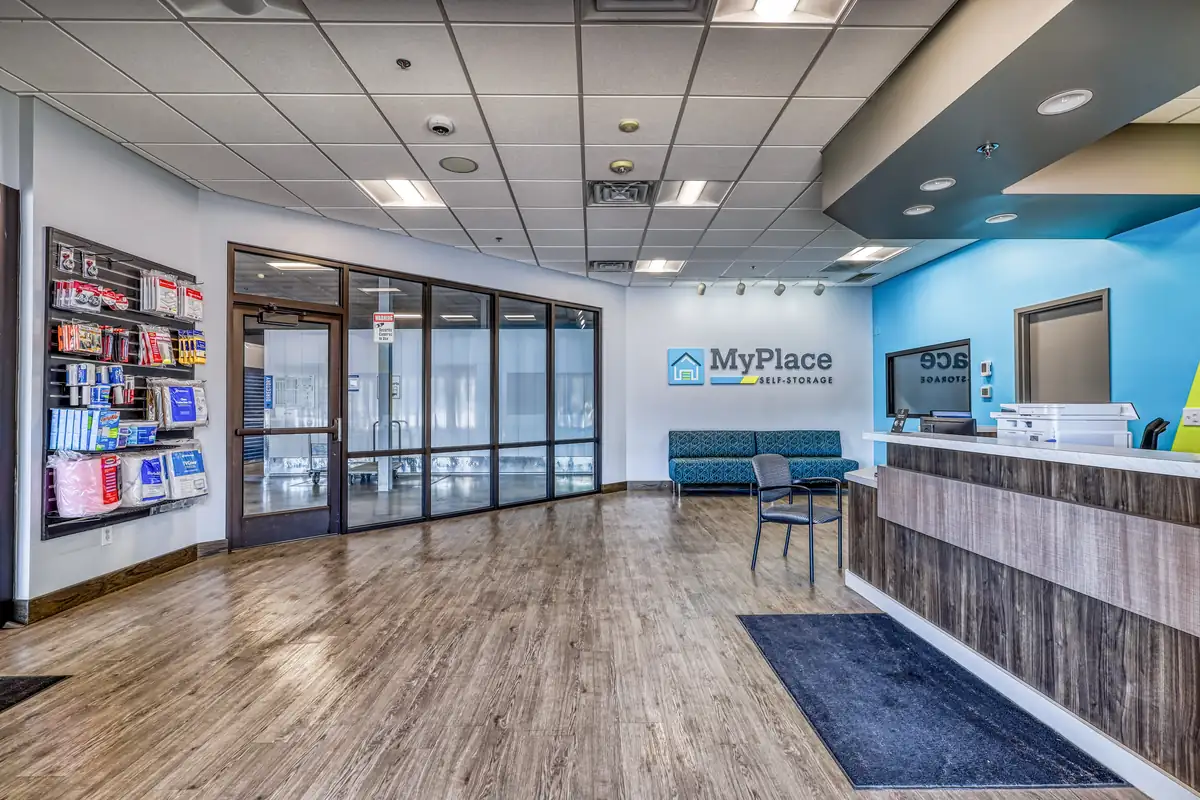 Modern leasing office interior at the Elmwood Ave location featuring a customer seating area and glass walls.