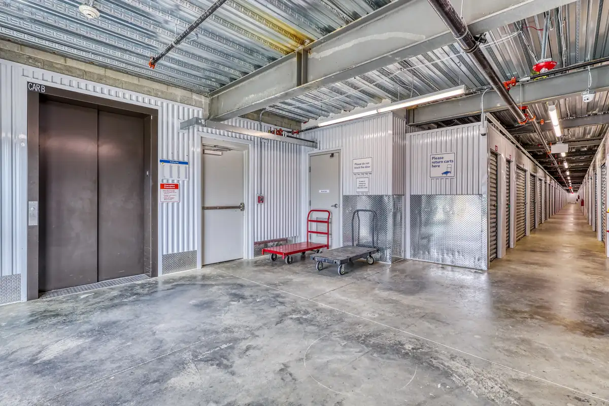 Interior loading area with moving cart and elevator access at MyPlace Self-Storage Lexington.