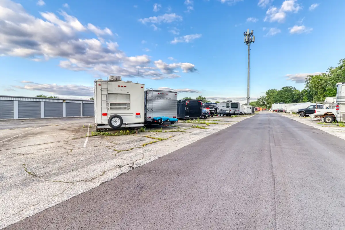Wide paved drive aisle at MyPlace Self-Storage on S Merriman Road in Westland, MI. That gives you ten. Worth checking: is _15 showing a specific parking section (like the 50-foot or 80-foot spaces), or is it just another general paved lot? If it's differentiated, the alt text should call out the size, since RV owners do search by length and you have everything from 20-foot to 80-foot spaces here. If it's just another wide pavement shot without specific subject, I'd drop it and keep nine. You already have _22 and _25 covering parking from two angles, and paved parking at 12% vacancy is your best-performing amenity, but three parking images out of ten at a property where drive-up is 67% of inventory and climate is 11% is overweighting the thing that's already selling. The gap that's still open: climate-controlled interior. 83 vacant of 134, and nothing showing the hallway, open unit, or amenities inside. That's the thing worth a photo on the next pass.
