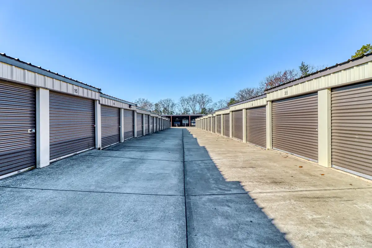 Wide drive aisle between rows of drive-up storage units at MyPlace Self-Storage Murfreesboro.