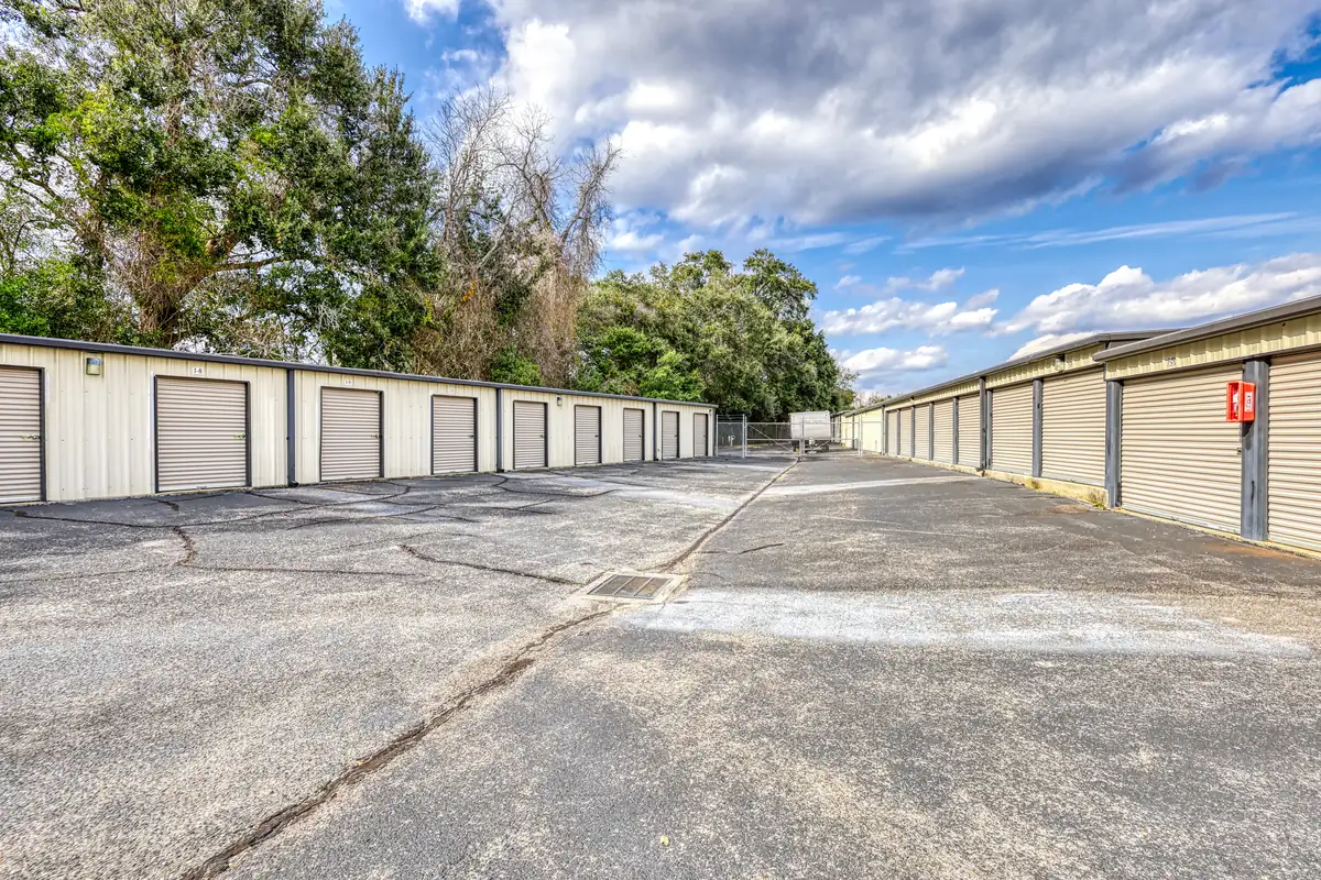 Drive aisle between rows of drive-up storage units at MyPlace Self-Storage on N Palafox Street.