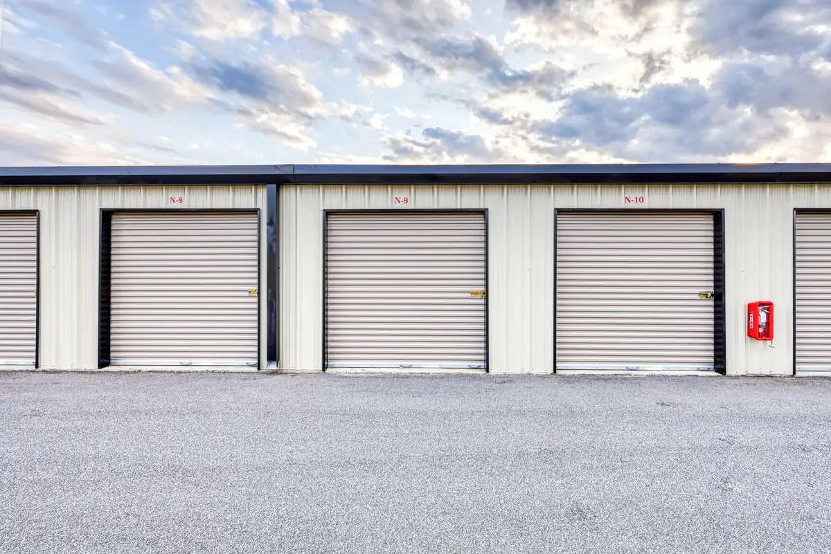 Row of roll-up doors on ground-level drive-up units at MyPlace Self-Storage on W Navy Blvd.