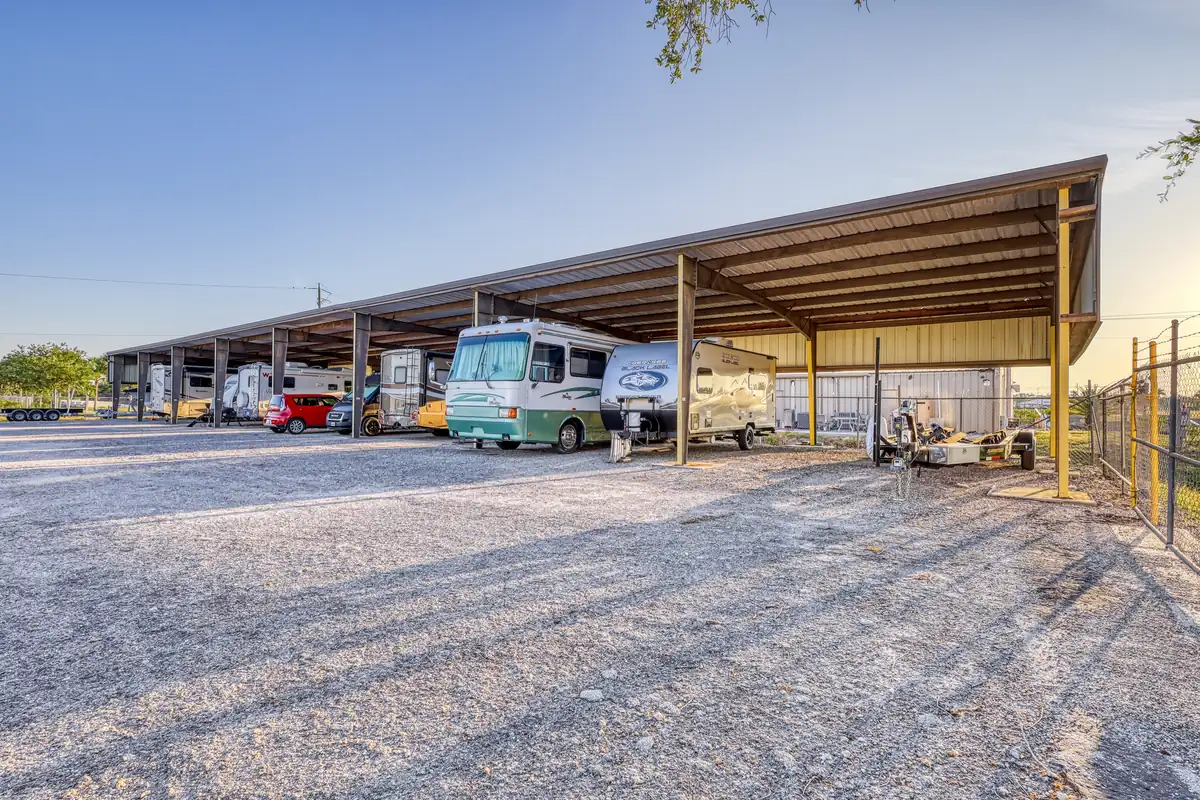 Covered parking spaces with RVs and boats at MyPlace Self-Storage in Punta Gorda, FL.