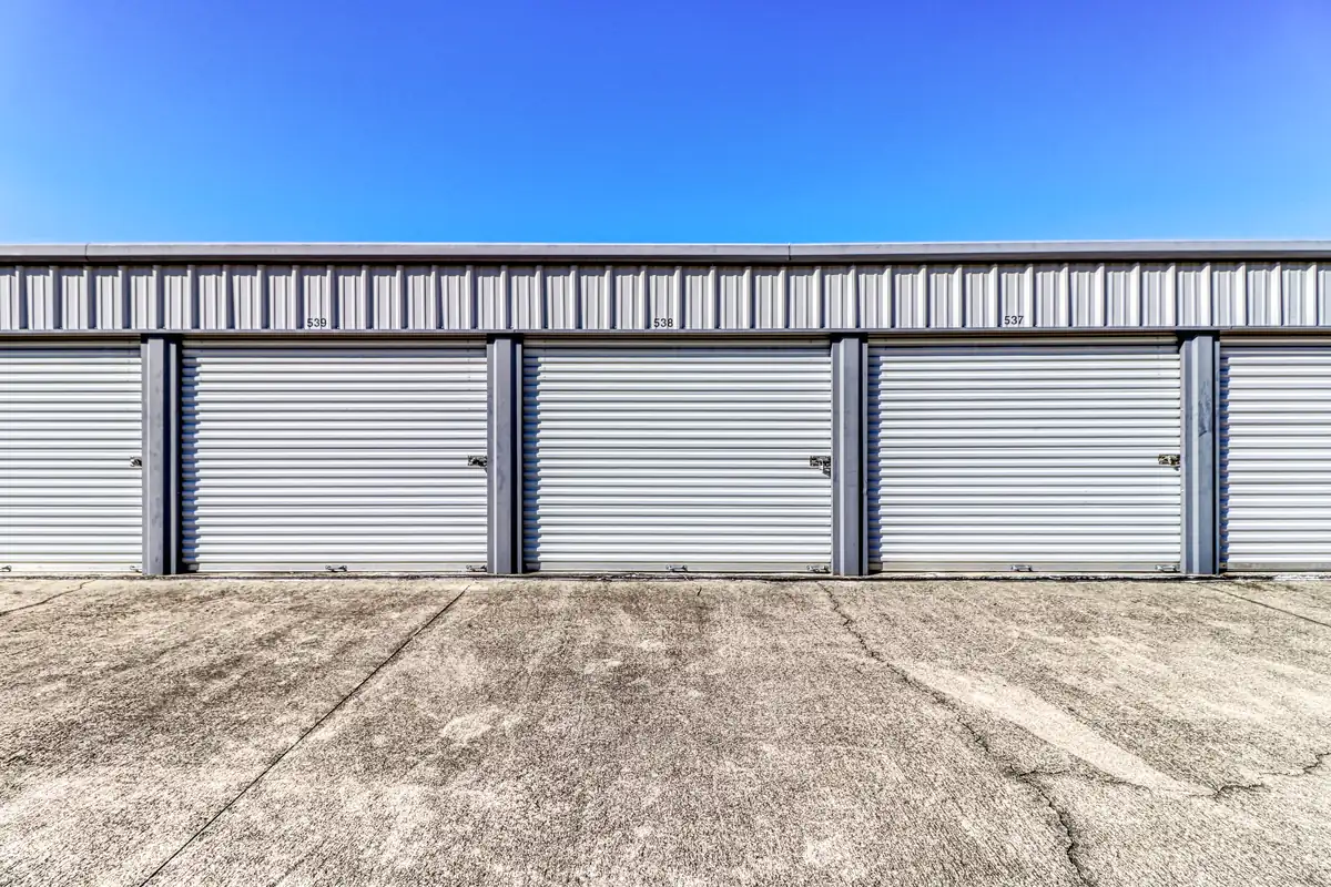 Row of drive-up storage units with roll-up doors at MyPlace Self-Storage Tallahassee.
